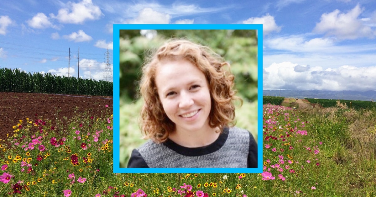 A photo of a girl in a field of flowers.