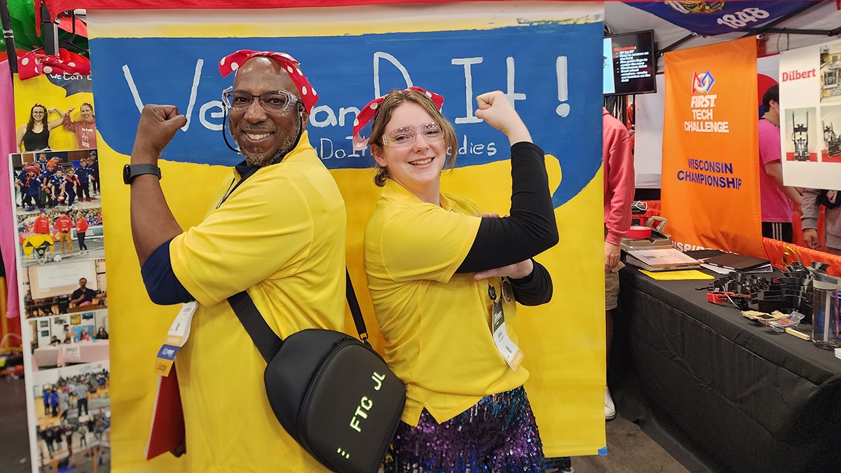 George Mitchom has fun showing his support with a fellow judge at the World Championships.