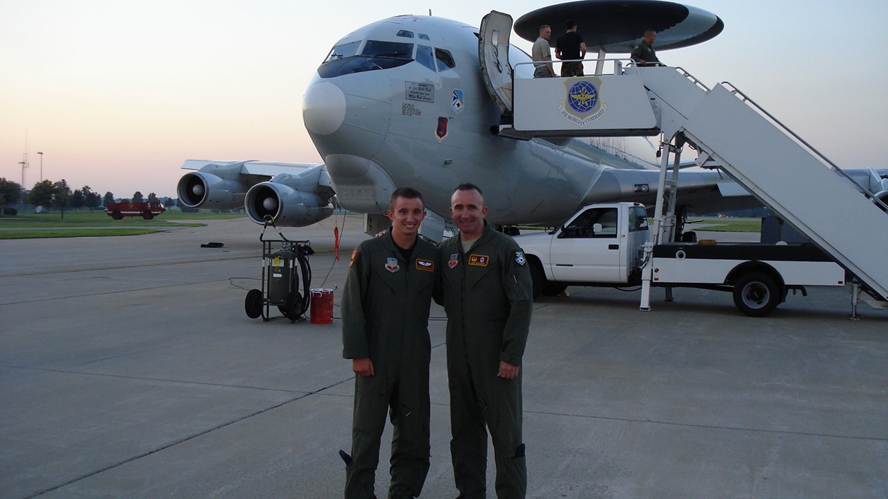 Ken is pictured with his son, who is on active duty. 