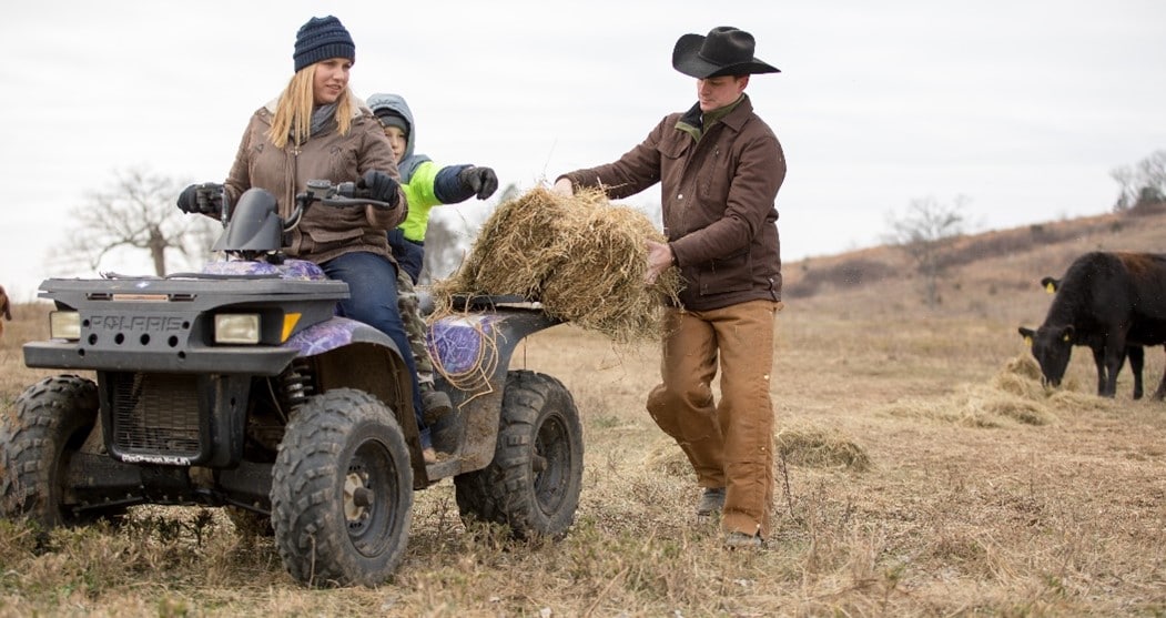 Bev and her family working on the farm