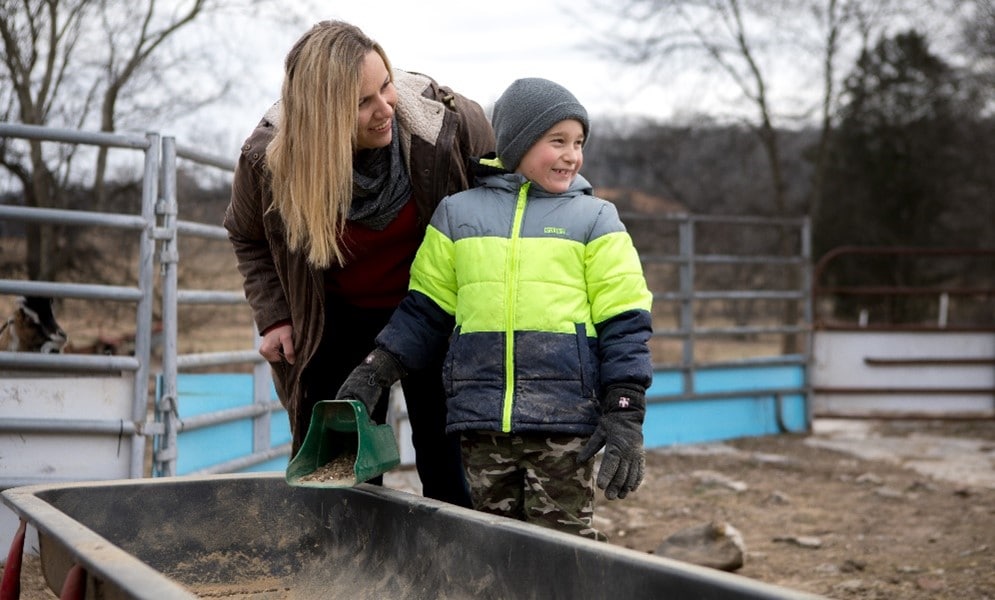 Bev and her family working on the farm