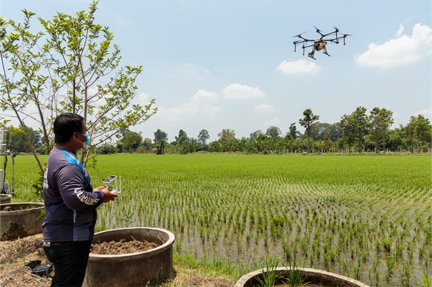 man controlling drone