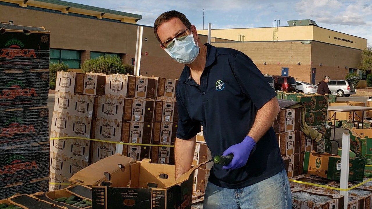 My colleague Brett Sowers packing boxes of produce.