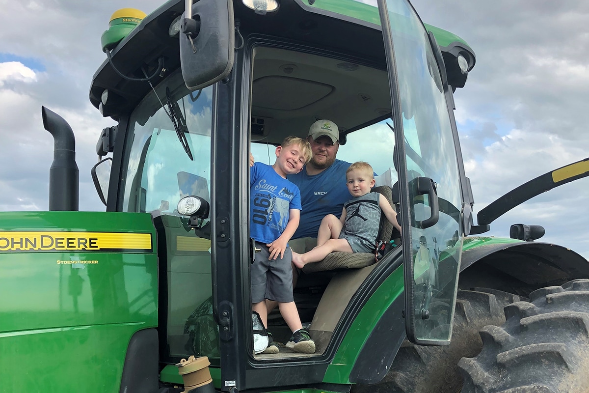 Craig and his sons on his tractor