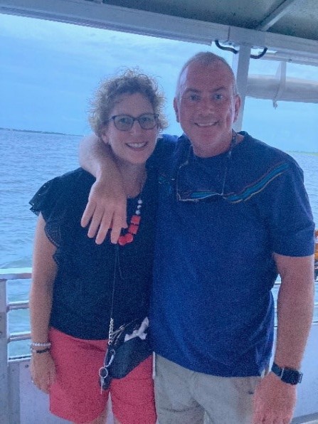 Couple standing on boat