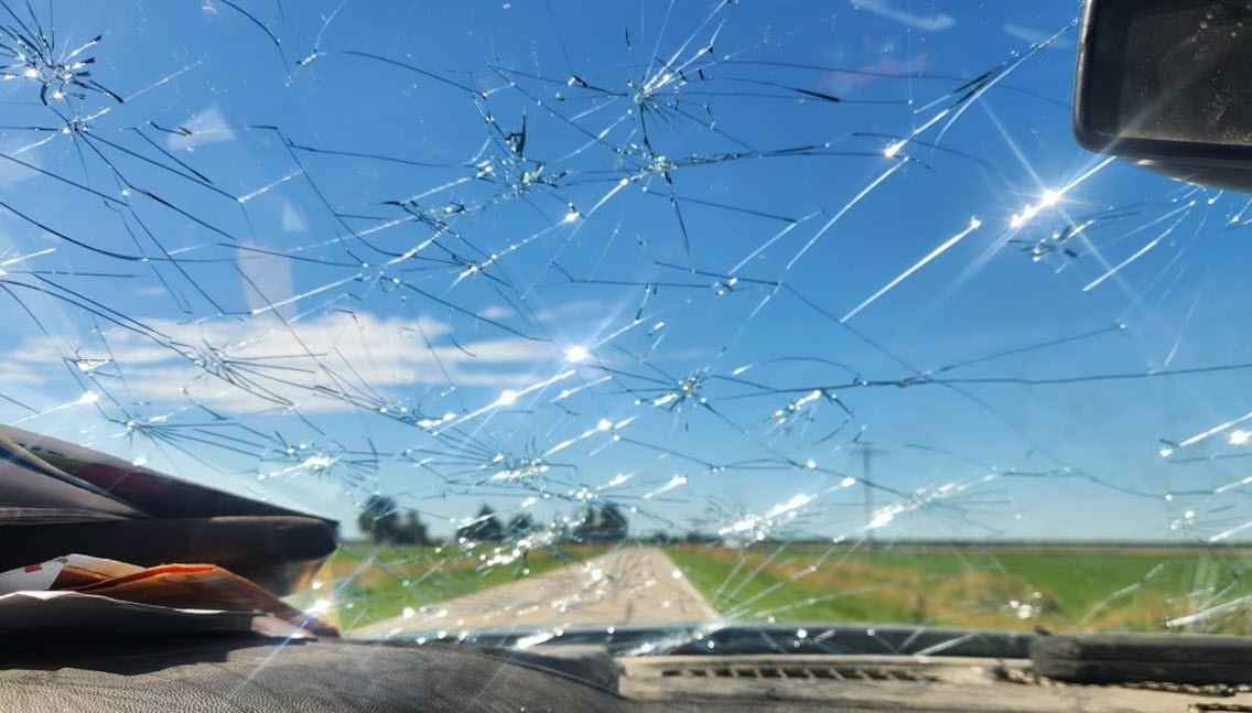 A pickup windshield after a hail storm. 