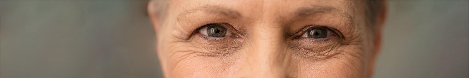 Close-up of a woman's face with wrinkles.