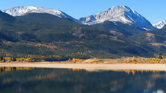 A lake with mountains in the background.