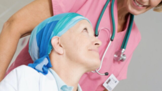 An older woman is being helped by a stethoscope.