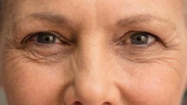 A close up of an older woman's face.