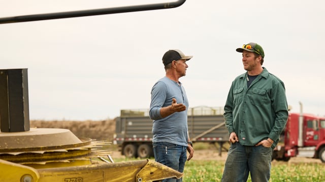 Farmers discussing their weed management