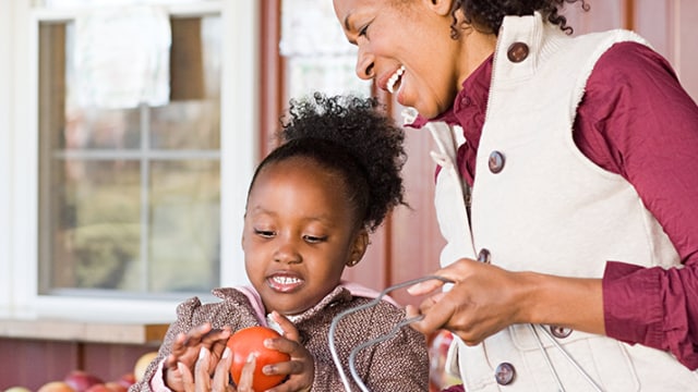 Grandmother and daughter picking out fruits and vegetables