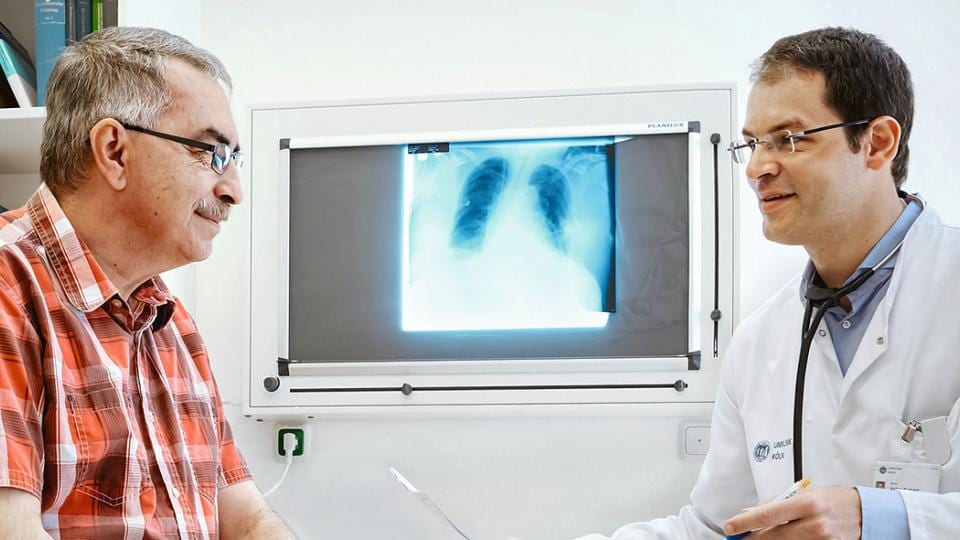 A man and woman looking at x-ray.