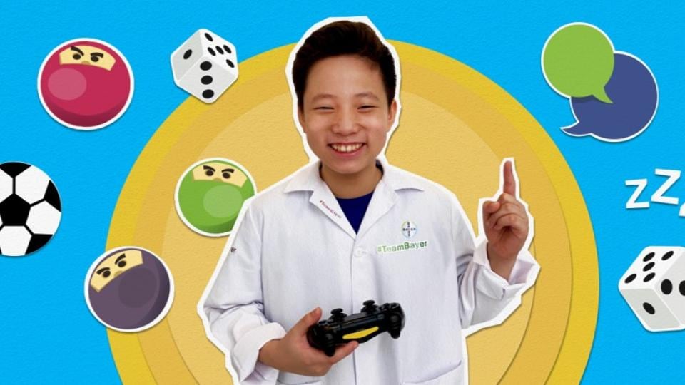 A man in a lab coat is holding a game controller.