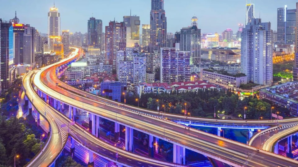 An aerial view of a city at dusk.