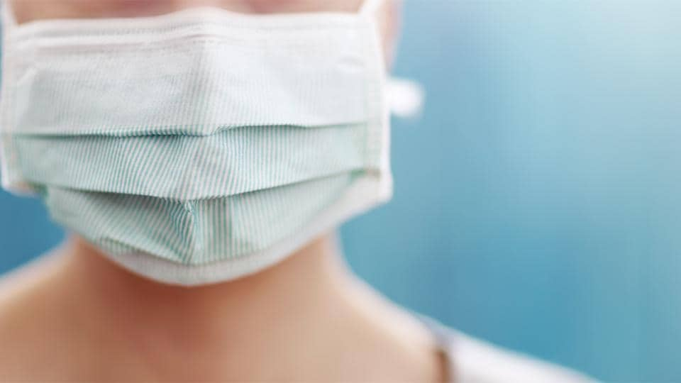 A person wearing a surgical mask.