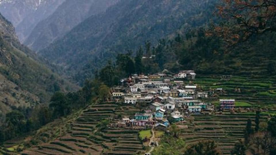 A village in the mountains near a valley.