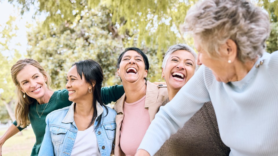 Women laughing in a park