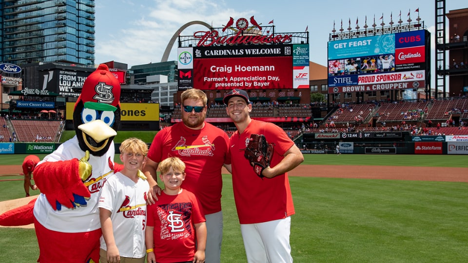 A farmer and his family at Busch Stadium for Farmer Appreciation