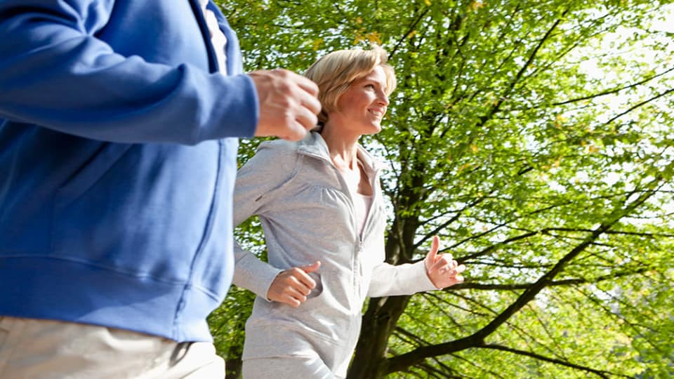 middle aged couple jogging