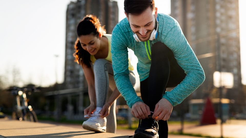 Joggers tie their shoes