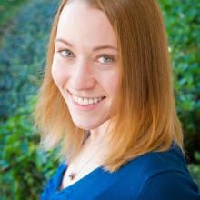 A woman wearing a blue shirt.